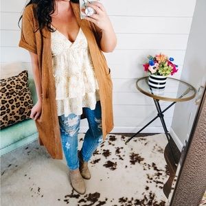 Camel short sleeve cardigan never worn. Size large